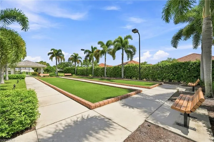 Bocce ball courts with artificial turf, bordered by brick paving