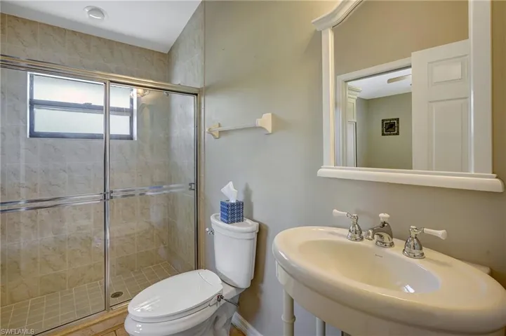Guest bathroom 1 with access to hallway and guest bedroom 1
