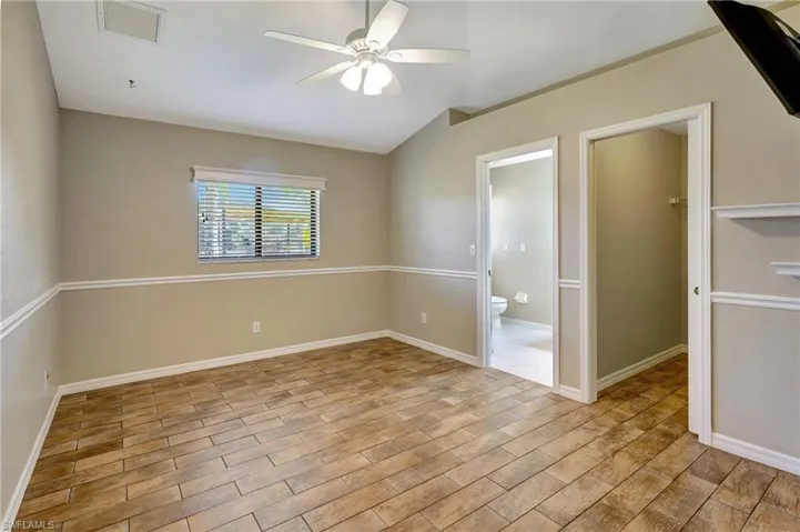 Guest suite 1 with en suite bathroom and walk-in closet