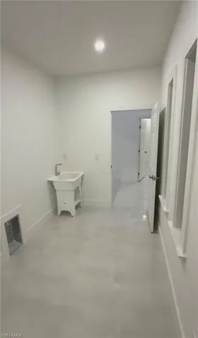 Laundry room featuring sink and washer and dryer hookup.