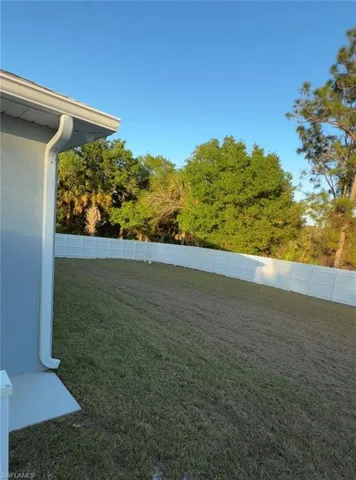 View of fenced backyard