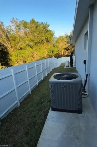 Fenced backyard with a patio