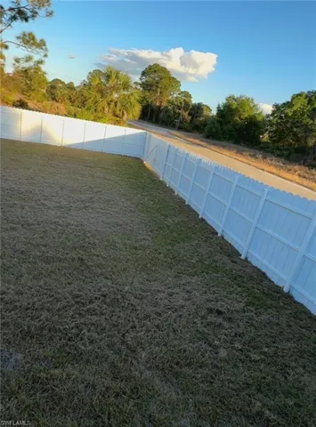View of fenced backyard