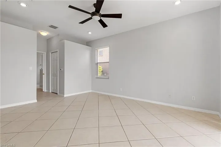 Unfurnished room featuring ceiling fan, recessed lighting, and light tile patterned floors