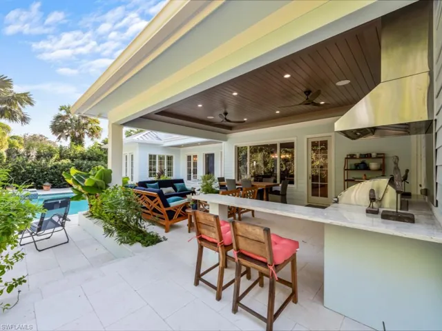 Even more seating surrounding summer kitchen