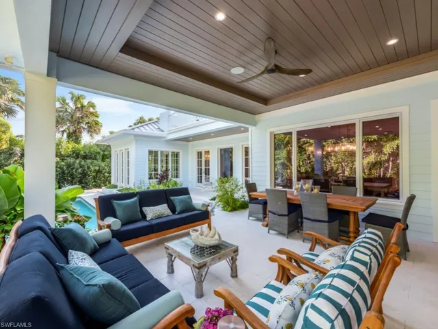 Just outside the media room, an outdoor living room