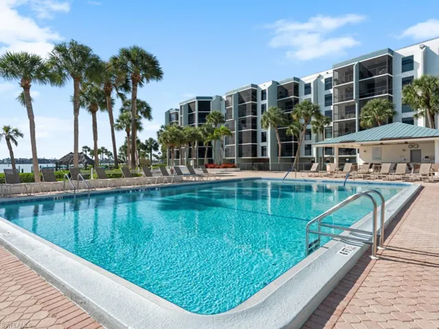 Community pool featuring a patio