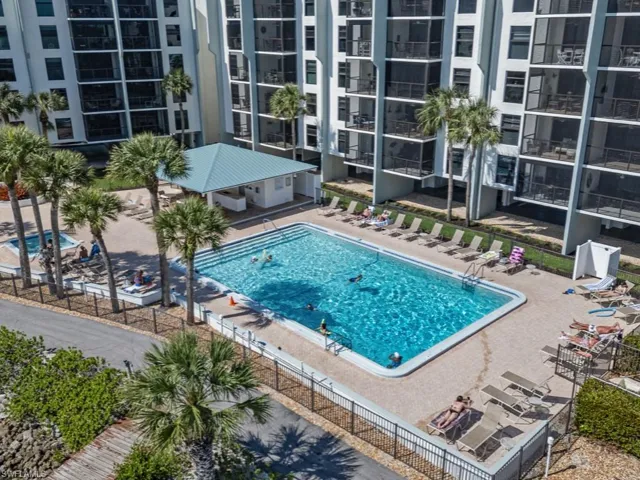 Community pool with a patio