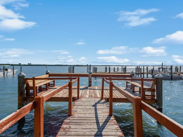 Dock area featuring a water view
