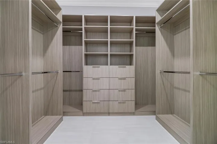 Spacious closet with tile patterned floors