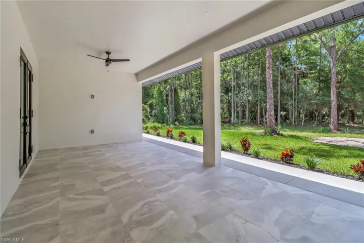 View of patio featuring ceiling fan