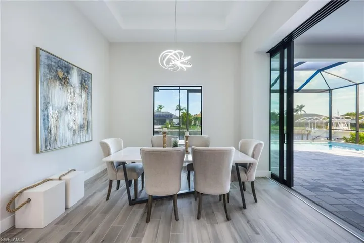 Dining space featuring an inviting chandelier and light hardwood / wood-style flooring