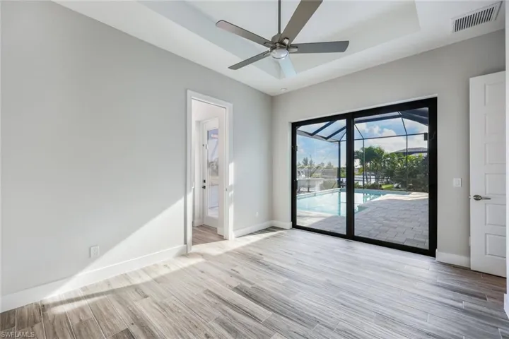 Unfurnished room featuring light hardwood / wood-style floors and ceiling fan