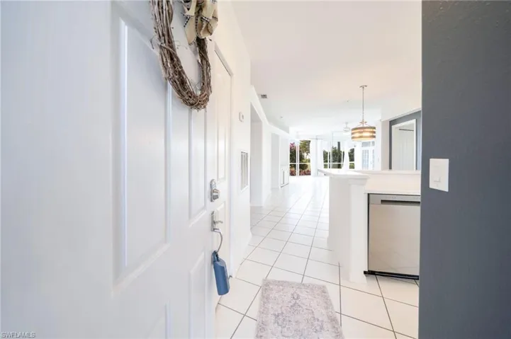 Hall with light tile patterned floors