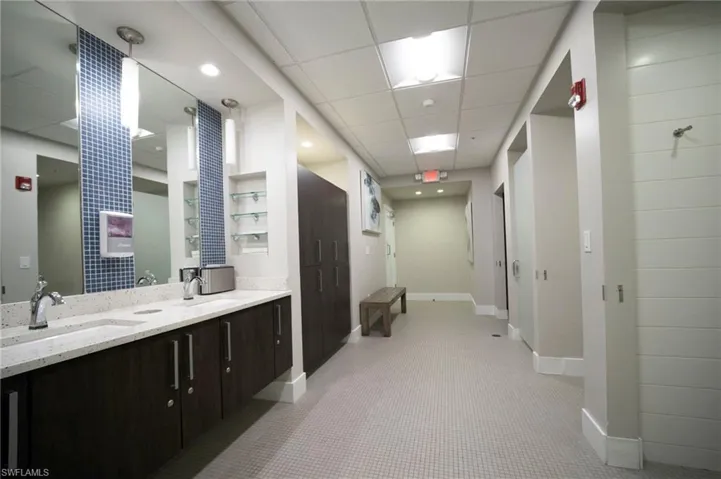 Bathroom with a drop ceiling and double vanity