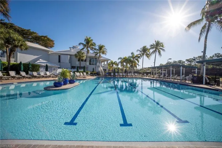 Community pool with a patio