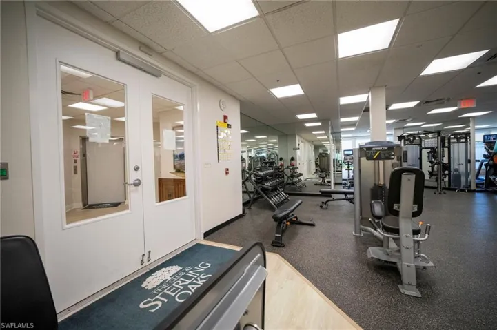 Workout area with a paneled ceiling