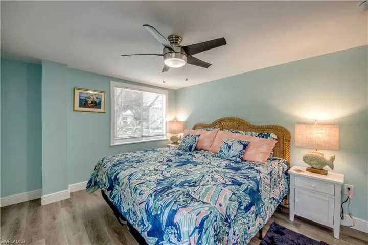 Bedroom featuring wood finished floors and ceiling fan