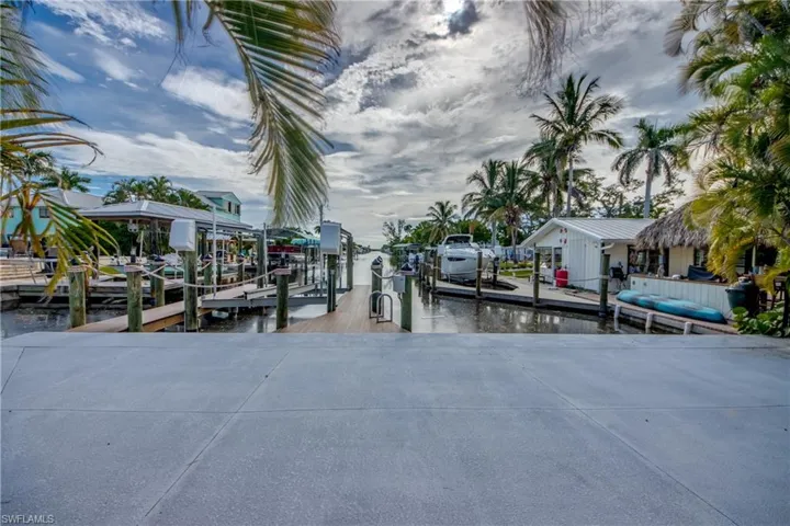 Dock area with a water view and boat lift