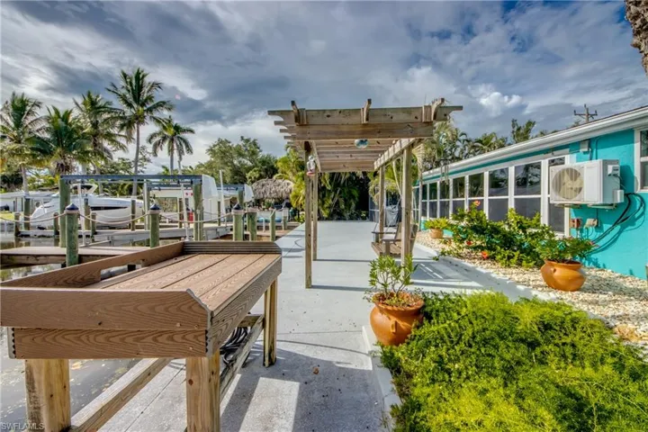 Dock area with a pergola and a patio