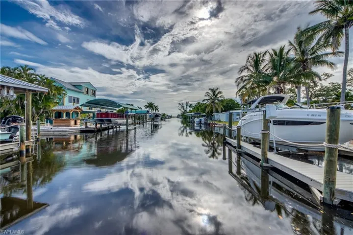 Dock with boat lift and a water view