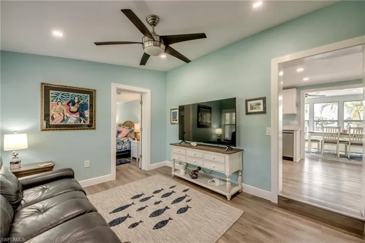 Living area featuring recessed lighting, light wood-type flooring, and a ceiling fan