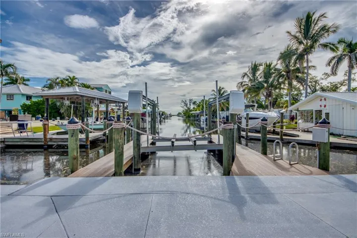 Dock featuring a water view and boat lift