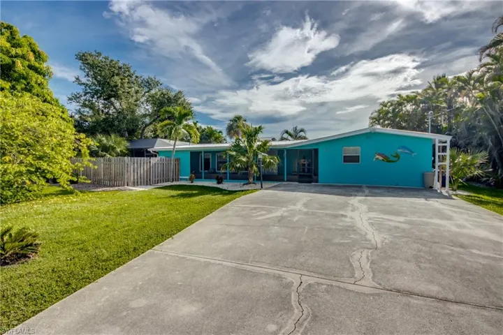 Ranch-style home with concrete driveway