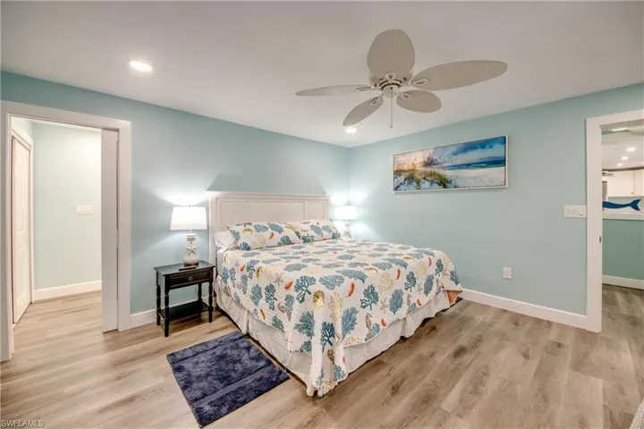 Bedroom featuring light wood finished floors, recessed lighting, and a ceiling fan