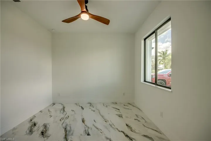 Empty room featuring ceiling fan