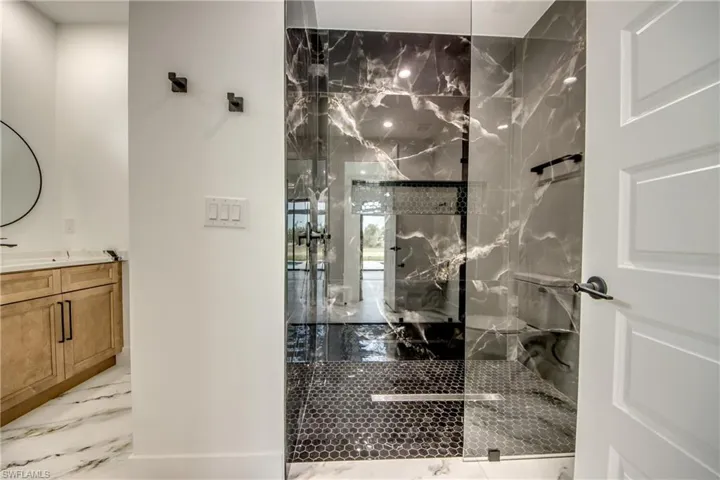 Bathroom featuring tile flooring and vanity