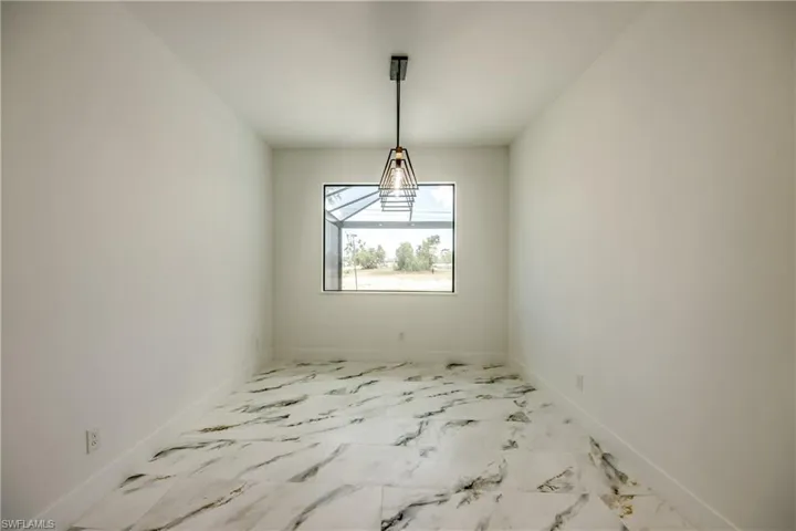 Unfurnished room with tile floors