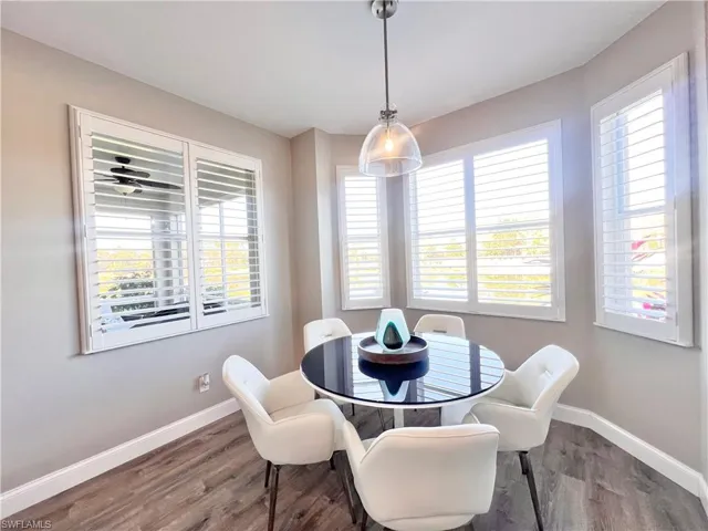 Kitchen area featuring light gray Deluxe Vinyl flooring