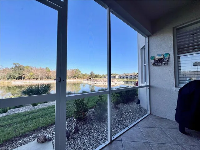 Sunroom with a water view