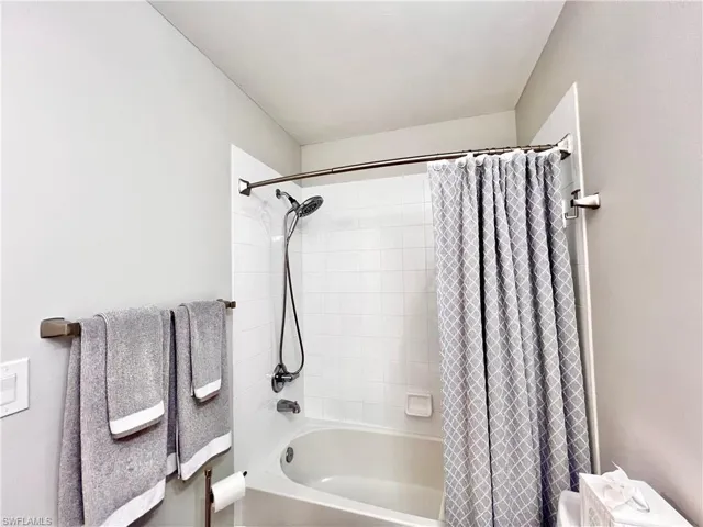Full bath featuring shower / bath combo