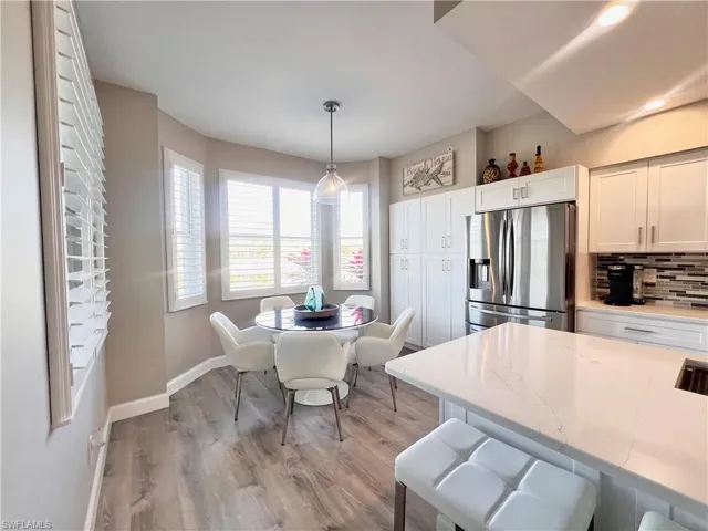 Kitchen area with extra large custom built double pantry wit pull out shelves.