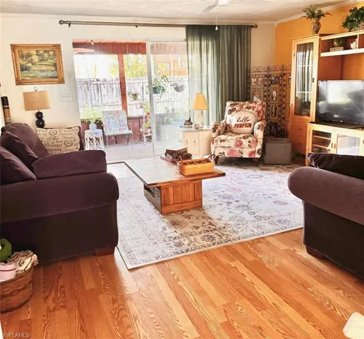 Family room with triplesliders to lanai
