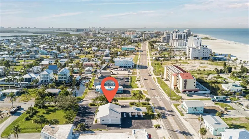 View of urban area featuring expansive beach
