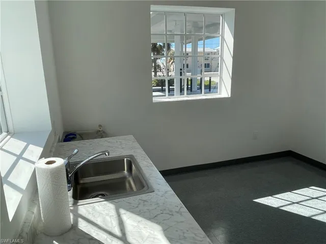 Spare room with french doors and dark carpet