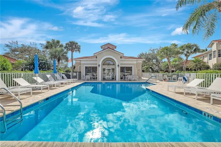 Clubside Reserve pool, spa and clubhouse. Featuring a patio with new outdoor furniture.
