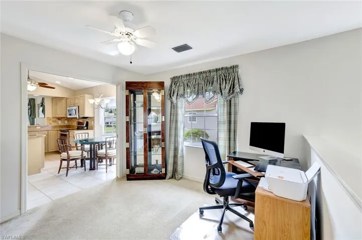 Flex space featuring pocket door. Can be used as a home office, dining area or den.