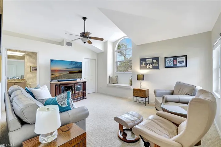 Media living room with lofted ceiling and ceiling fan.  Can be utilized as the third bedroom. Full bath and walk-in closet.