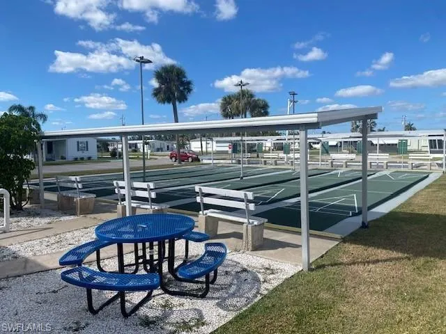 View of property's community with shuffleboard