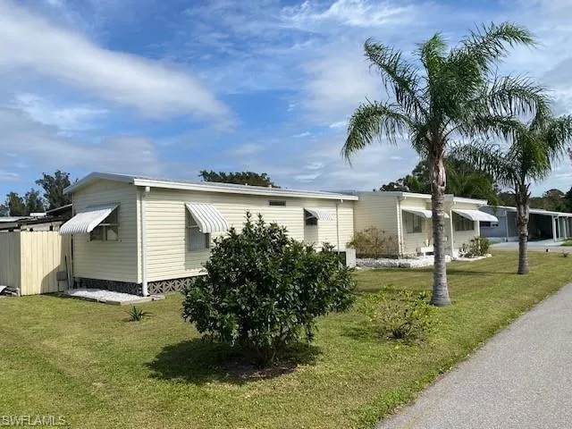View of front of home featuring a front lawn