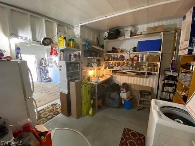 Storage area featuring washer / clothes dryer