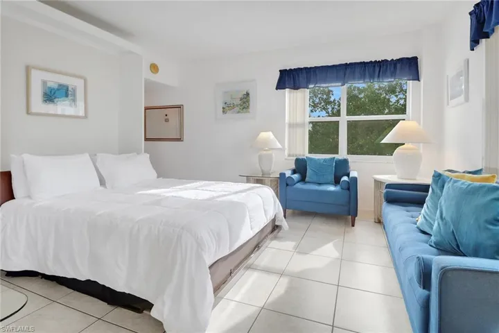 Bedroom with light tile patterned floors