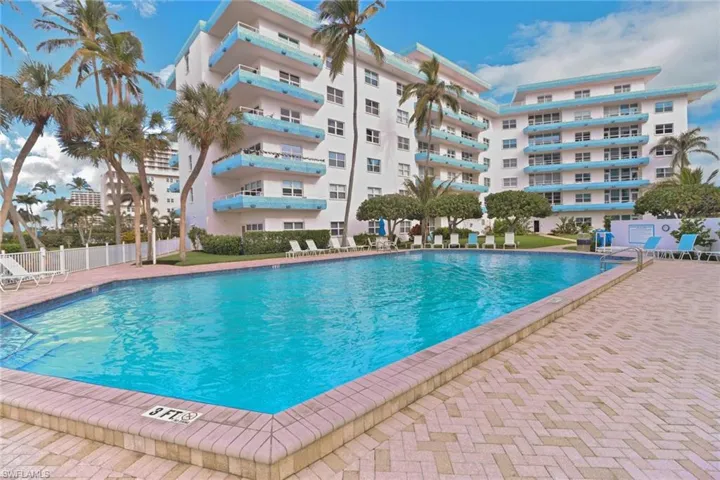 Community pool featuring fence