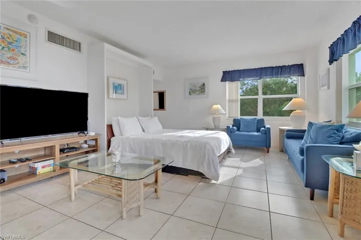 Bedroom featuring light tile patterned flooring