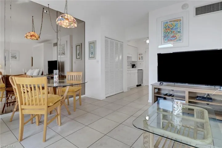 Dining space featuring light tile patterned flooring