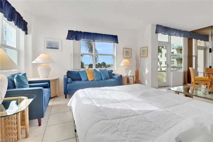Bedroom with light tile patterned flooring